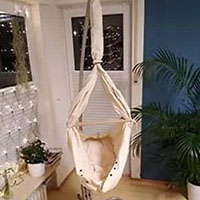 natural coloured baby hammock in a stand