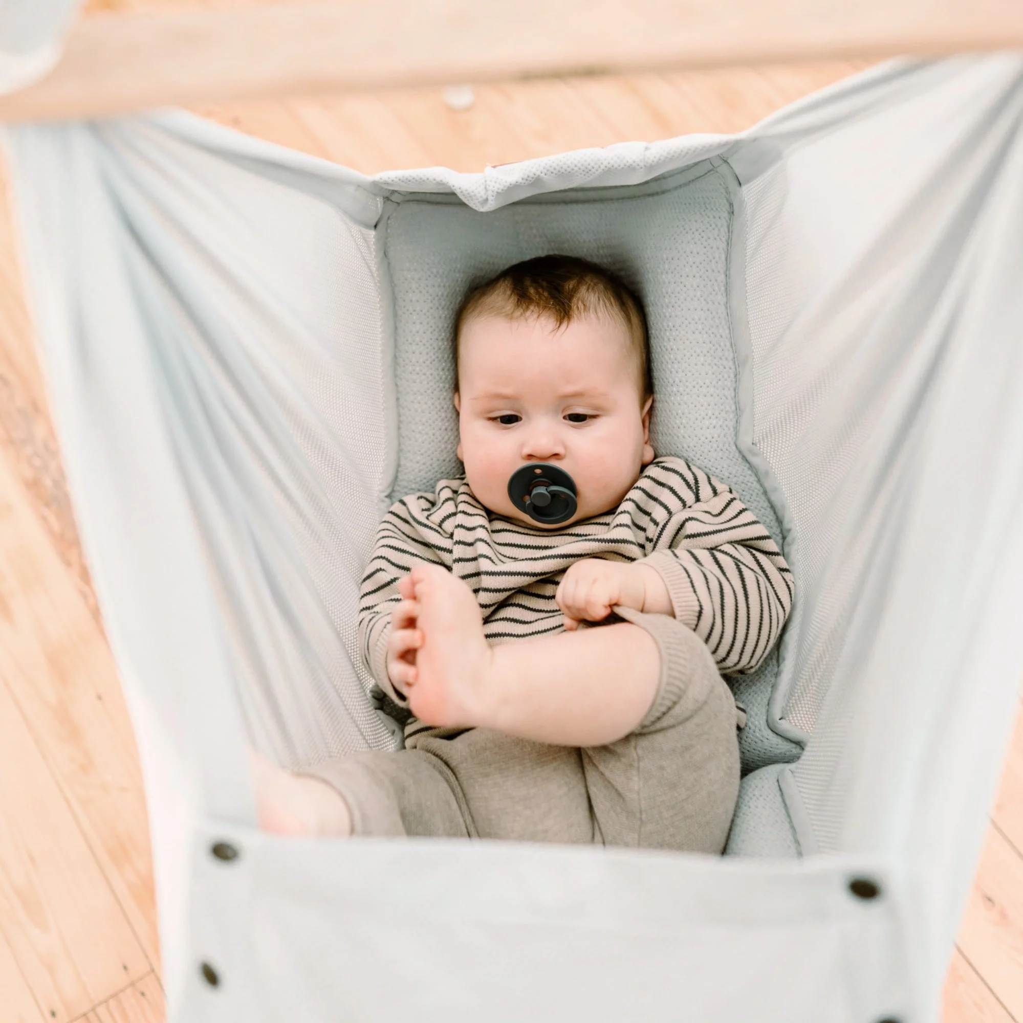 Swinging newborn 2024 baby