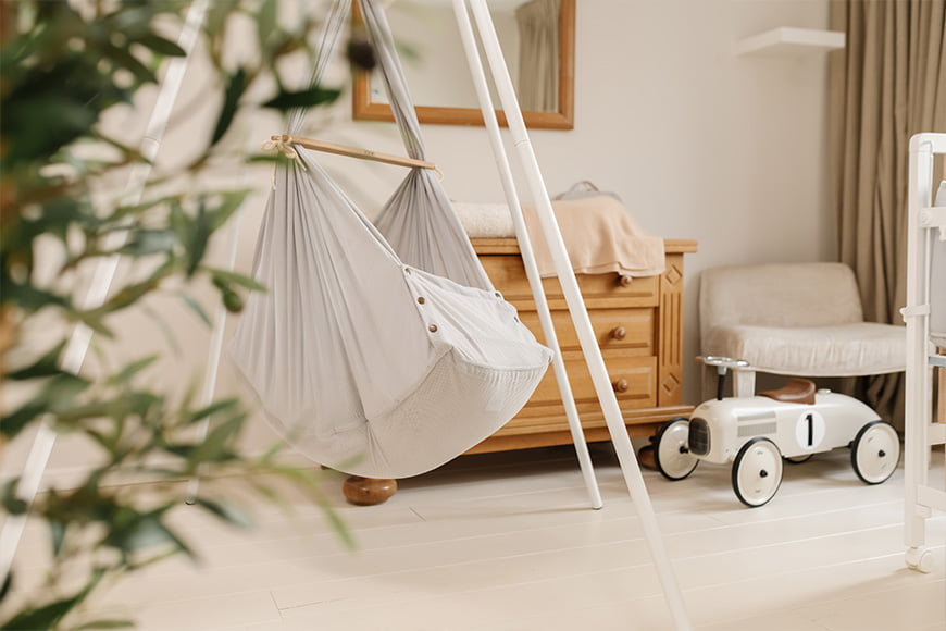 Swinging Hammock mounted on Tipi Stand in baby's bedroom